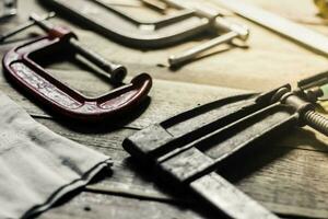 Vintage tone woodworking tool set on wood floor photo