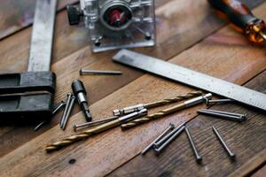 Collection of woodworking tools on a wooden background. photo