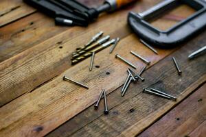 Collection of woodworking tools on a wooden background. photo