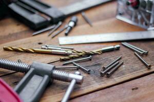 Collection of woodworking tools on a wooden background. photo