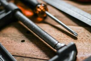 Collection of woodworking tools on a wooden background. photo