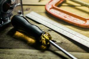 Collection of woodworking tools on a wooden background. photo