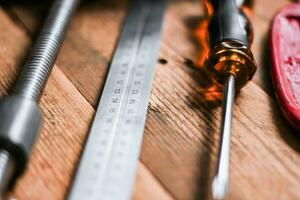 Collection of woodworking tools on a wooden background. photo