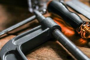 Collection of woodworking tools on a wooden background. photo