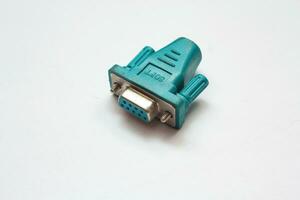 The blue-green serial connector looks similar to the blue VGA connector on a white background. photo