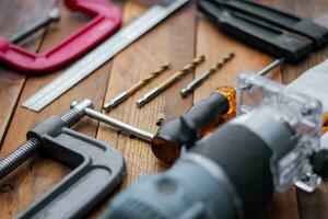 Collection of woodworking tools on a wooden background. photo