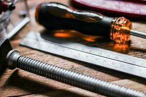 Collection of woodworking tools on a wooden background. photo