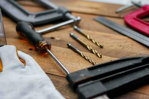 Collection of woodworking tools on a wooden background. photo