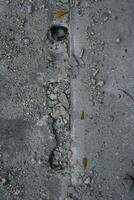 cracked concrete floor texture for background, closeup of photo. photo