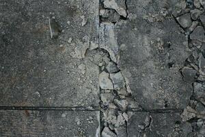 Grunge concrete wall with cracks and holes. Abstract background. photo