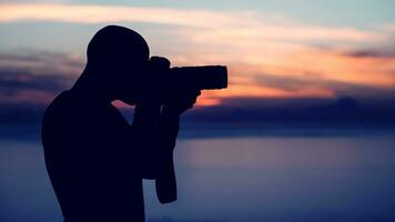 Photographer taking picture outdoors photo