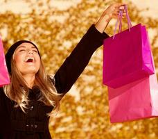 Girl with pink shopping bags photo