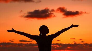 Woman's silhouette on sunset light photo