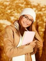 Cute businesswoman with books photo