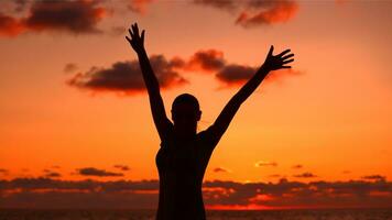 Woman's silhouette in sunset light photo