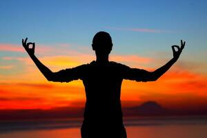 Woman meditating outdoors photo