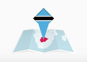 Botswana is depicted on a folded paper map and pinned location marker with flag of Botswana. vector