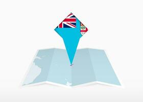 Fiji is depicted on a folded paper map and pinned location marker with flag of Fiji. vector