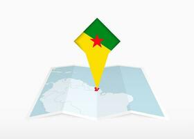 francés Guayana es representado en un doblada papel mapa y clavado ubicación marcador con bandera de francés Guayana. vector