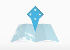 micronesia es representado en un doblada papel mapa y clavado ubicación marcador con bandera de micronesia vector