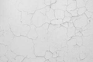Cracked flaking white paint on the wall, background texture photo