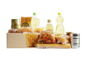 Foodstuffs in donation box isolated on white background with clipping path for volunteer to help people. photo