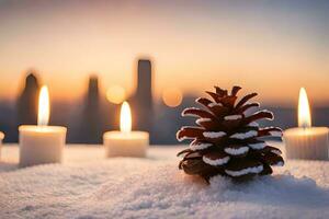 ai generado velas y pino conos en el nieve a puesta de sol foto