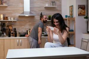 Caucasian couple with narcotic drugs addiction getting bag of white powder. Woman holding cocaine, heroin, illegal substance in hand waiting to inhale for dependence and craving photo