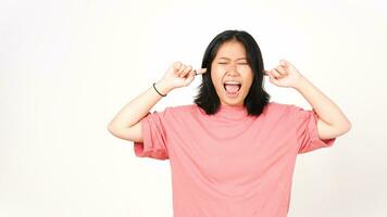 Young Asian woman in pink t-shirt closed ears from bothering noise on isolated white background photo