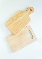 Pair of wooden chopping boards in top view, closed up shot on white background. photo