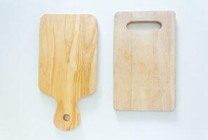 Two wooden chopping boards in top view, closed up shot on white background. photo