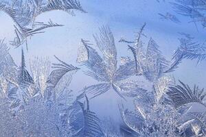 frosty patterns on the window frosty background Ice on a window photo