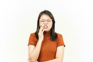 Suffering Toothache Gesture Of Beautiful Asian Woman Isolated On White Background photo