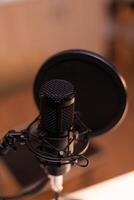 Close up of microphone at recording studio, technology and audio equipment. Recording social media content with production microphone, digital web internet streaming station photo