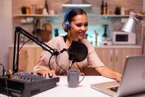 Speaking into professional microphone during podcast in home studio. Creative online show On-air production internet broadcast host streaming live content, recording digital social media communication photo