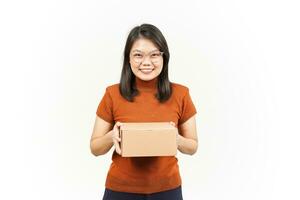 Holding Package Box or Cardboard Box and Give it To You Of Beautiful Asian Woman Isolated On White photo