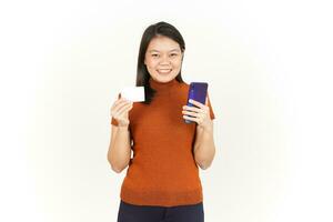 Holding Smartphone and Blank Bank Card or Credit Card Of Beautiful Asian Woman Isolated On White photo