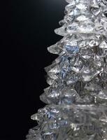 Stepped layering of ice with blue highlights inside isolated on black photo