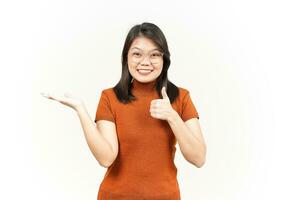 Presenting and Showing Product on Open Palm With Thumbs up Of Beautiful Asian Woman photo