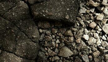 Broken Asphalt And Gravel Stones Background photo