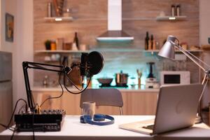 Professional setup for recording podcast in home studio of vlogger. Influencer recording social media content with production microphone. Digital web internet streaming station photo