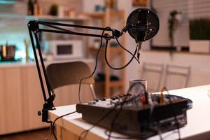 Microphone and mixer for podcast of famous influencer. Recording social media content with production microphone. Digital web internet streaming station photo