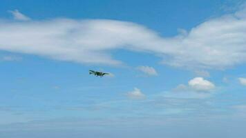 PHUKET, THAILAND - JANUARY 26, 2023. Light small coast guard plane landing over the beach. Airplane over the beach, blue sky background video