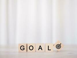 Wooden blocks with the word GOAL. The concept of Goal achievement , target, strategy and success photo