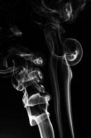 White smoke in a black background. smoke white light photo