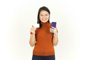 Holding Smartphone and Blank Bank Card or Credit Card Of Beautiful Asian Woman Isolated On White photo