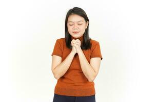 Fold Hand And Pray Of Beautiful Asian Woman Isolated On White Background photo