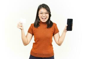 Holding Blank Bank Card and Smartphone With Blank Screen Of Beautiful Asian Woman Isolated On White photo