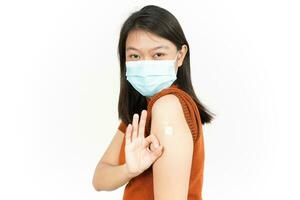 Wearing Mask And Get A Corona Virus Vaccine Of Beautiful Asian Woman Isolated On White Background photo