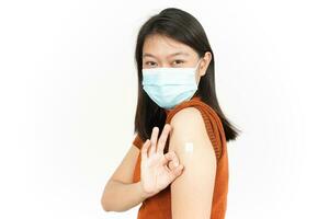 Wearing Mask And Get A Corona Virus Vaccine Of Beautiful Asian Woman Isolated On White Background photo